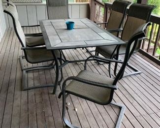 Tile Topped Outdoor Table with Six Rocker Chairs