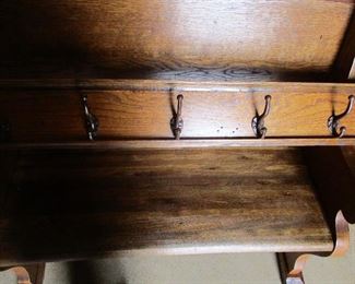 ONEOF THREE OAK AND IRON COAT RACK