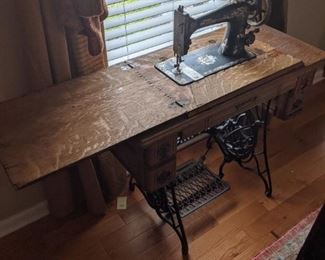 Singer sewing machine - comes with the accessories in the drawers and folds up into a table for space-saving purposes.