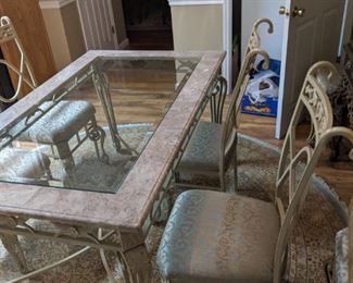 Wrought iron and marble dining table and wrought iron chair set with custom made cushions (6 chairs) - Original price was about $3000, but we are selling it for far less than this - looking for it to go to a good home!
