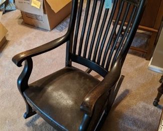 Brown leather rocking chair - old school and very sturdy - when you think of a rocking chair, this is what comes to mind