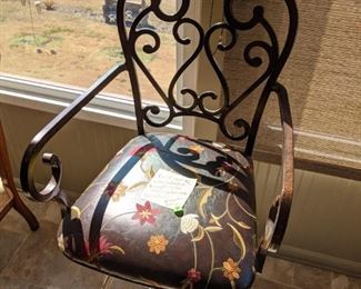 Pair of these custom leather and wrought iron bar stools - we have more of this fabric that can be purchased as well, if you'd like to cover other furniture with it and match