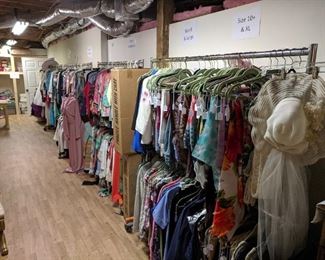 Tons of women's clothing - all sizes and varieties, all on racks for you to peruse. CHEAP name brand stuff $1-3 on tons of items