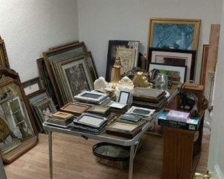 An abundance of frames and artwork - the frames themselves are great, even if you aren't a fan of the particular piece of art they contain. We have a bunch of empty picture frames and mirrors in this room