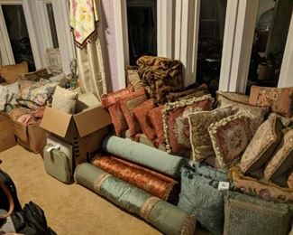 Tons of really really high quality pillows - down feather pillows with custom fabrics that were made by hand abound on one side of the room, and the more budget friendly (but still nice) pillows on the other side are also available