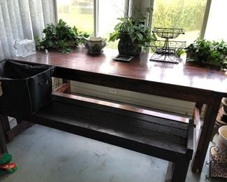 Farm house table.  Shown with bench and faux florals