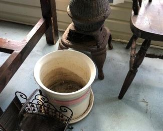 Very vintage cast iron stove, ceramic plant pot and metal basket