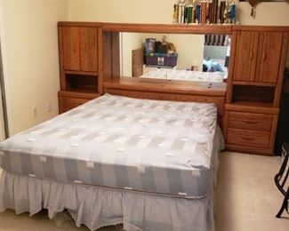 solid heavy oak wood headboard set with middle cabinet with storage, lights, and mirror; 2 sides cabinets; and a large mirror dresser chest (shown on next picture)