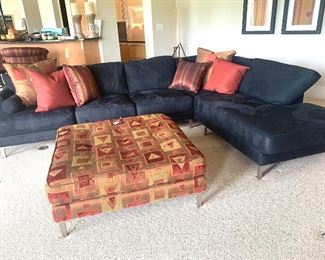 L-shaped contemporary style sofa by Carter. 
Approx measurements 10’6” x 7’6” 