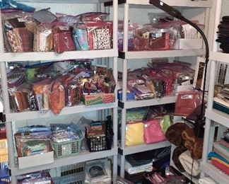 quilting fabrics and quarters (numerous) , large pieces of fabric, large bolts of fabric