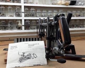 Precision miter saw with manual