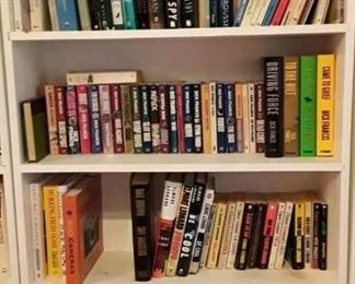Book collections by JK Rowling, Clive Cussler, Martin Cruz Smith, Dick Francis, John D MacDonald, Robert Ludlum, Len Deighton, Julie Smith, Patricia Cornwell, 
PG Wodehouse and bookshelves. Not all collections pictured - see list. 
