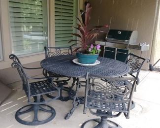 Outdoor wr iron table & 4 swivel rockers