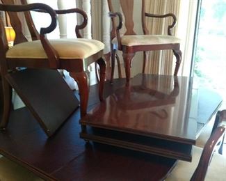 8 chairs, w/2 captain. All custom pads. 3 leaves extend to 126" excellent condition.