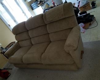 tan, cloth, reclining  living room set. Sofa: 80"