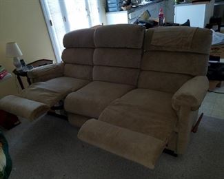 tan, cloth, reclining  living room set. Sofa: 80"