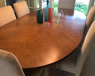 Mid-century modern styling dining table:   (68" x 48") w one leaf (20" ) - shown and 4 side chairs and 2 armchairs - $1200 set 