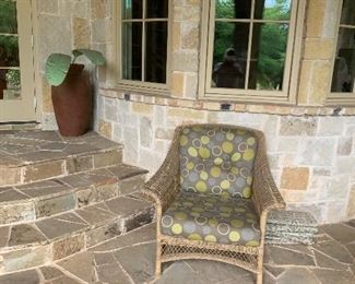 Outdoor wicker chair, clay pots 