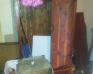 Early 1900's hand crank butter churn. Features the bent wood legs and four paddles on the inside. Sitting behind is a cedar chifferobe the hinges came off the door but we have all the pieces.