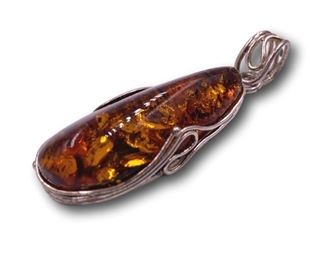Sterling silver and amber pendant. Bidding ends at 3 p.m. on 7-20-2020. Register at https://auctions.mlestatesales.com. Don't forget to check out our other auctions too!
