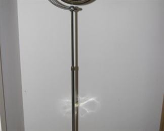 Tall magnifying mirror.
