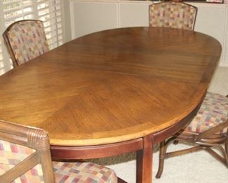 Dining table 4 chairs/leaves and pads.