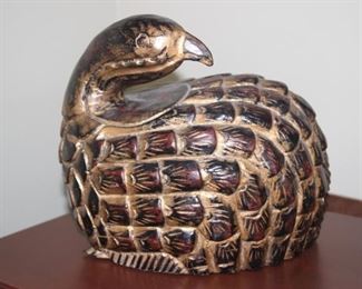 Hand carved wooden quail figure.