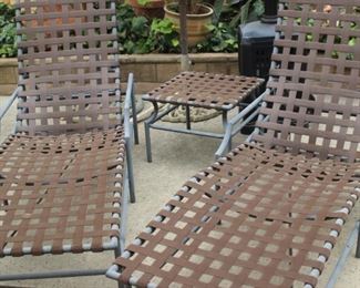 Sun loungers and end table.