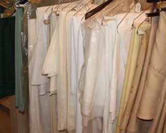 Hangers full of table linens and napkins.