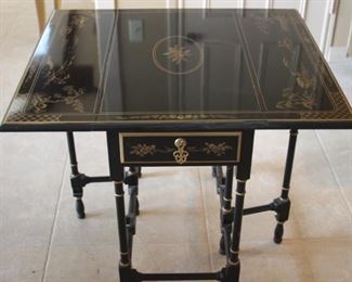 Drop leaf Asian themed end table.