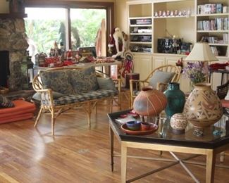Bamboo and rattan furniture, large coffee table, Native American Indian items, stereo components, CDs, DVDs, art and table lamps.