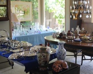 Tables of silver plate, crystal and bone china.