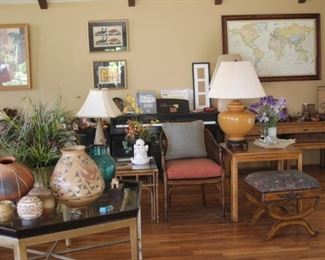 Bamboo and rattan furniture, large coffee table, Native American Indian items, stereo components, CDs, DVDs, art and table lamps.