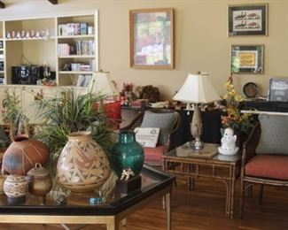 Great room with pottery, Yamaha piano/organ, cane back chairs, rattan/bamboo and glass tables.