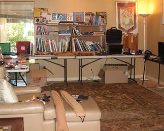 family room, leather chair and ottoman, bookcases filled with art books, three TVs, laptop, ipod Nanos, Samsung tablet. Boards games, puzzles, poker sets and playing cards.