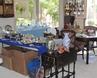 Tables of silver plate, crystal and bone china.