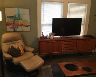 Leather recliner with ottoman
Mid century modern credenza/Buffet 
Flat screen TVs
Mid century modern coffee table
