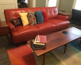 Your books
Vintage coffee table mid century modern
Orange sofa wonderful rug