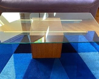 20% off of $295 Mid-century modern glass top coffee table on wood block base with brass supports