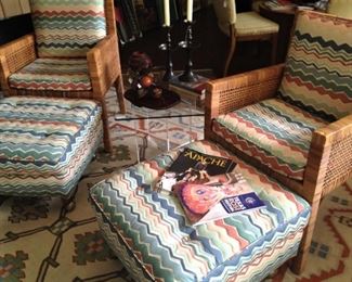 Small glass top table between the chairs