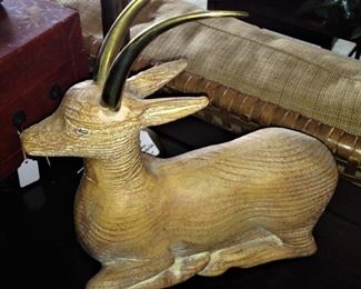 One of two matching carved animals