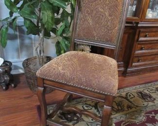 closeup of chair that goes with formal dining set