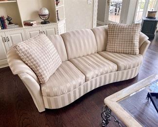 kidney shaped white sofa