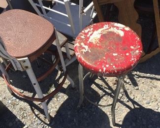 lots of rusty stools for plant stands