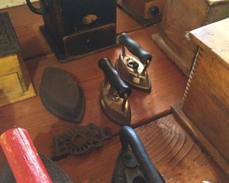 lots of old irons and coffee grinders