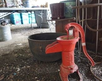 Red jacket pitcher pump, cast iron wash pot.