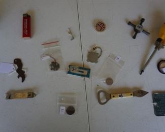 Screwball ratchet driver, eagle necklace pendant, General Electric tubes 4 way wrench, Sears 4 way key chain, Lower right ID plate for a 1951 Chieftain Catalina Coup Super Deluxe, Mac Tools magnet