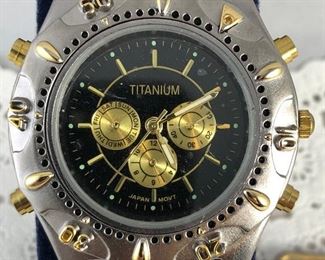 14. Titanium Universal Quartz Men's Watch Asking $109.00