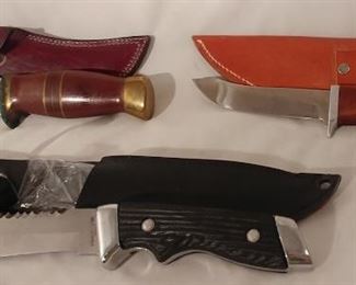 10. Jody Cooper John Nelson Samson #199-2449 with Sheath Asking $875.00 (left), Bowie Knife Engraved Wolf with Sheath Asking $99.00 (front), Bowie Knife with Wood Handle with Sheath Asking $55.00 (right)