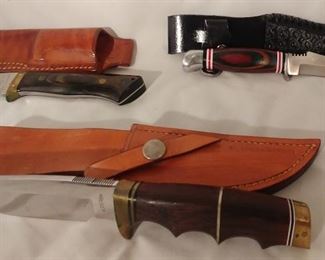 11. Jack Walden Del City, OK Bowie Knife with Sheath Asking $75.00 (left), H. Corbey Bowie Knife with Sheath Asking $425.00 (front), Multicolored Wood Handle Bowie Knife with Sheath Asking $85.00 (right)